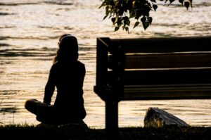 image of a women spending time in solitude to find hope to restore her loneliness.