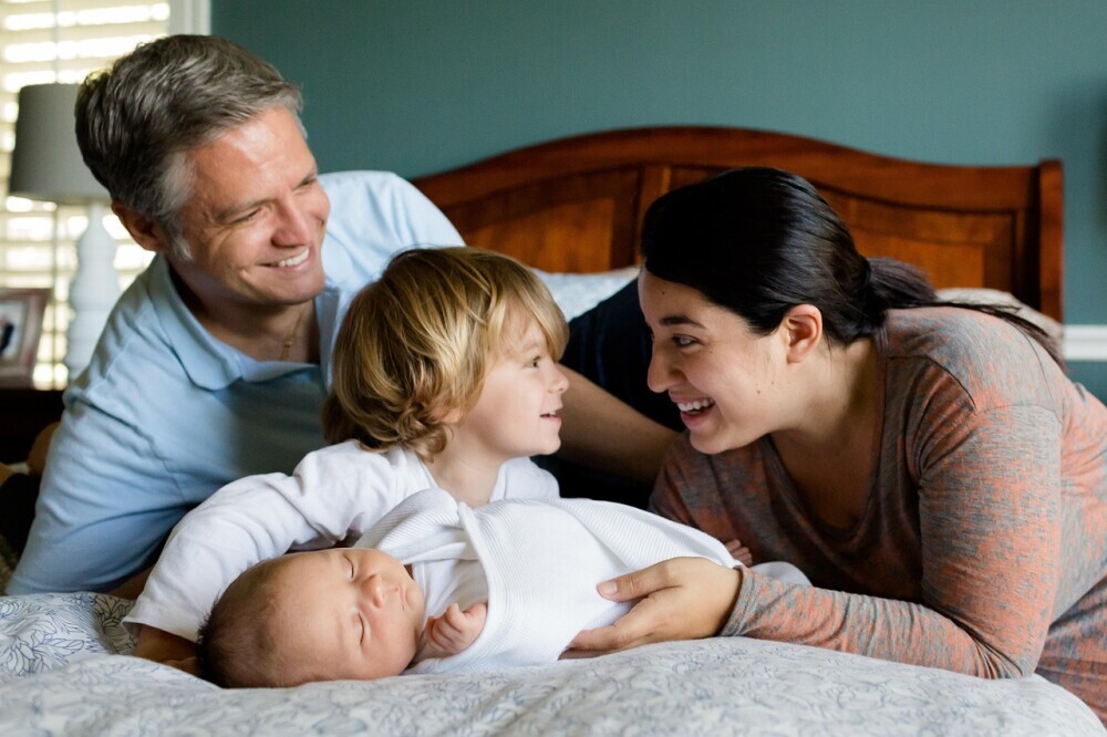 A loving parent reading a colorful bedtime story to their child, fostering a warm and nurturing bedtime routine. - - Parenting